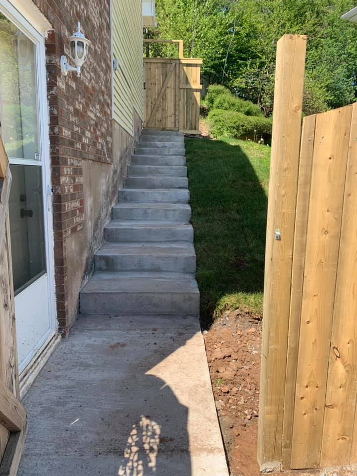 Concrete steps and pressure treated privacy fence